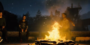 Charaktere aus The Quarry sitzen im Dunkeln am Lagerfeuer.